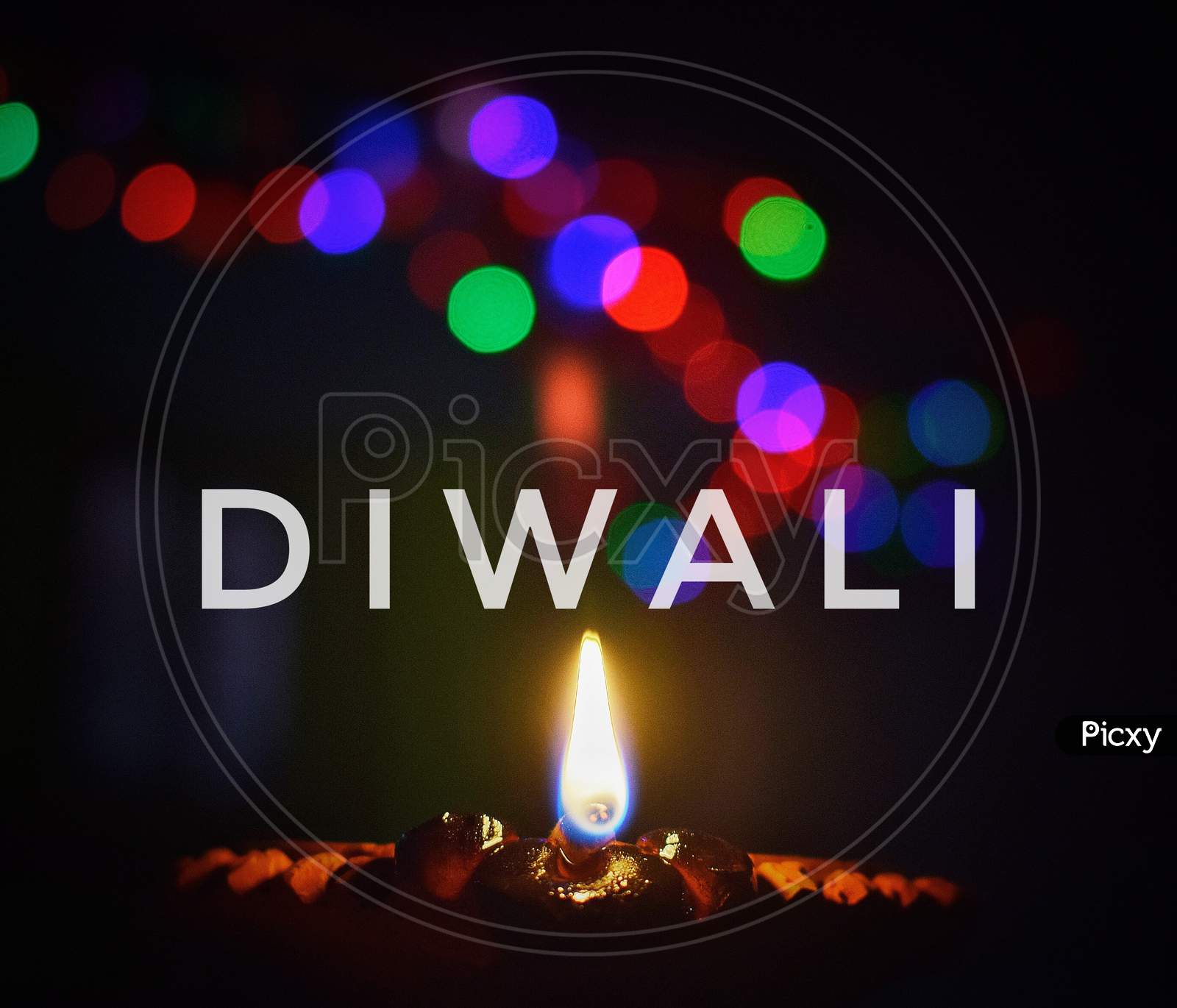 Diya and bokeh of lightning. Decoration on the occasion of Diwali. Indian festival.