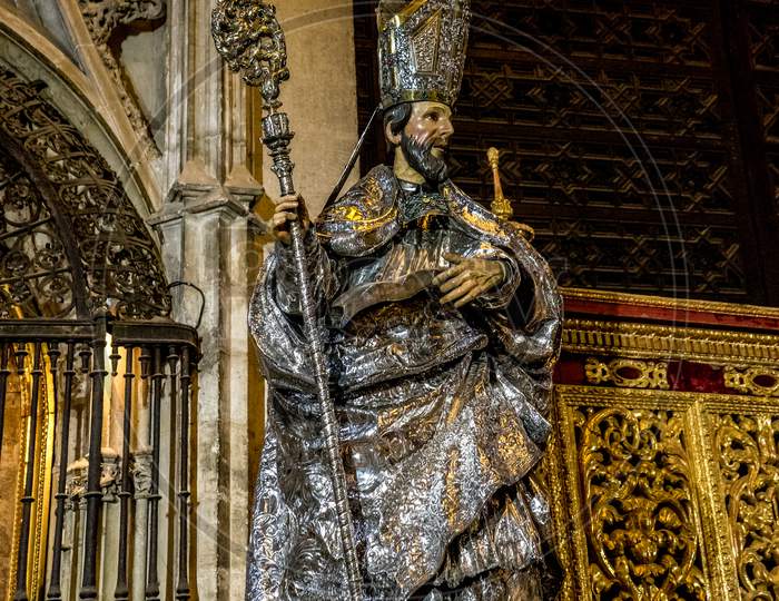 Seville, Spain- June 18, 2017: A Statue Of A Saint Inside The  Gothic Cathedral In Seville, Spain June 2017