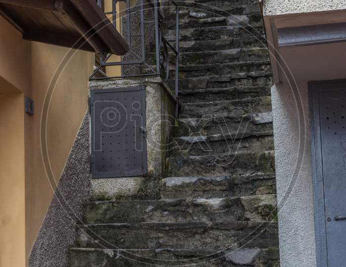 Italy, Varenna, Lake Como, A Close Up Of A Narrow Stairs