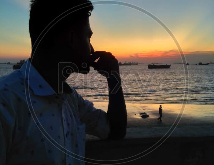 A Man enjoying the Sunset