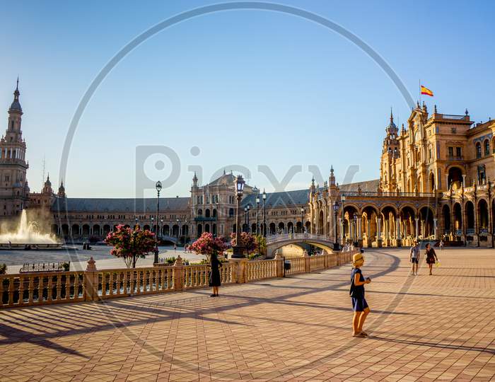 Seville, Spain- June 18, 2017 : People Gather Next To The Water Fountain At The Plaza De Espana In Seville, Spain June 2017 On A Hot Summer Day.