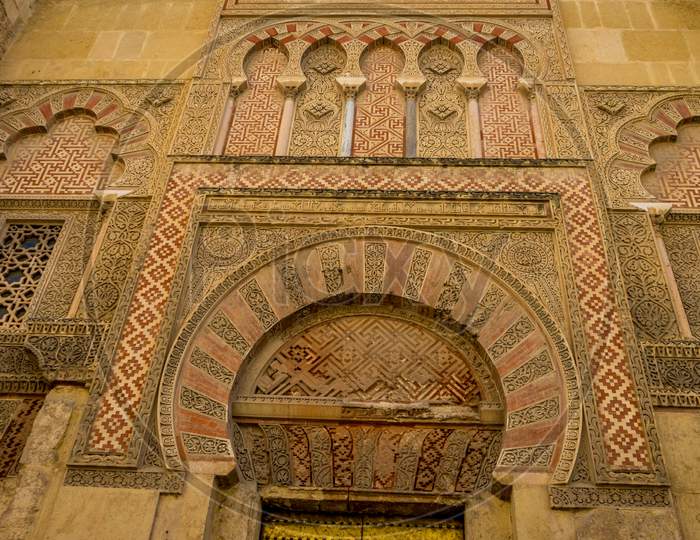 Intricate Moorish Design Pattern On The Wall Of A Building In Cordoba