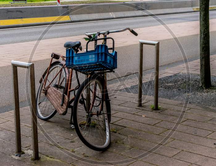 Netherlands, Rotterdam,  Bucyle With Basket At A Parking Lot