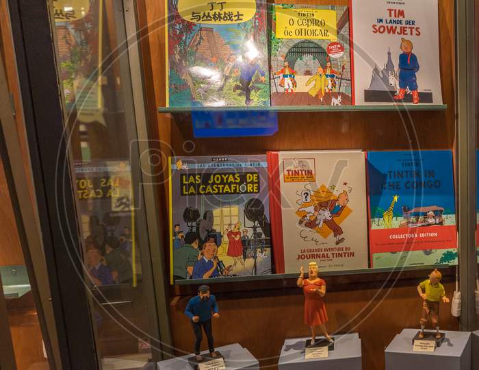 Brussels, Belgium - April 17 : Tintin Comics And Sculptures Are Displayed In A Window Of A Shop In Brussels, Belgium On April 17, 2017
