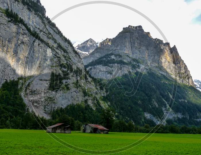 Switzerland, Lauterbrunnen, Scenic View Of Landscape And Mountains Against Sky