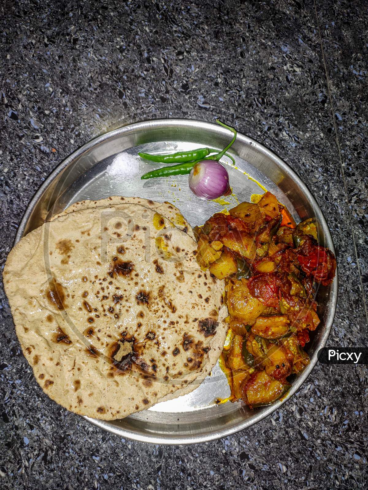 Roti with potato and brinjal fry