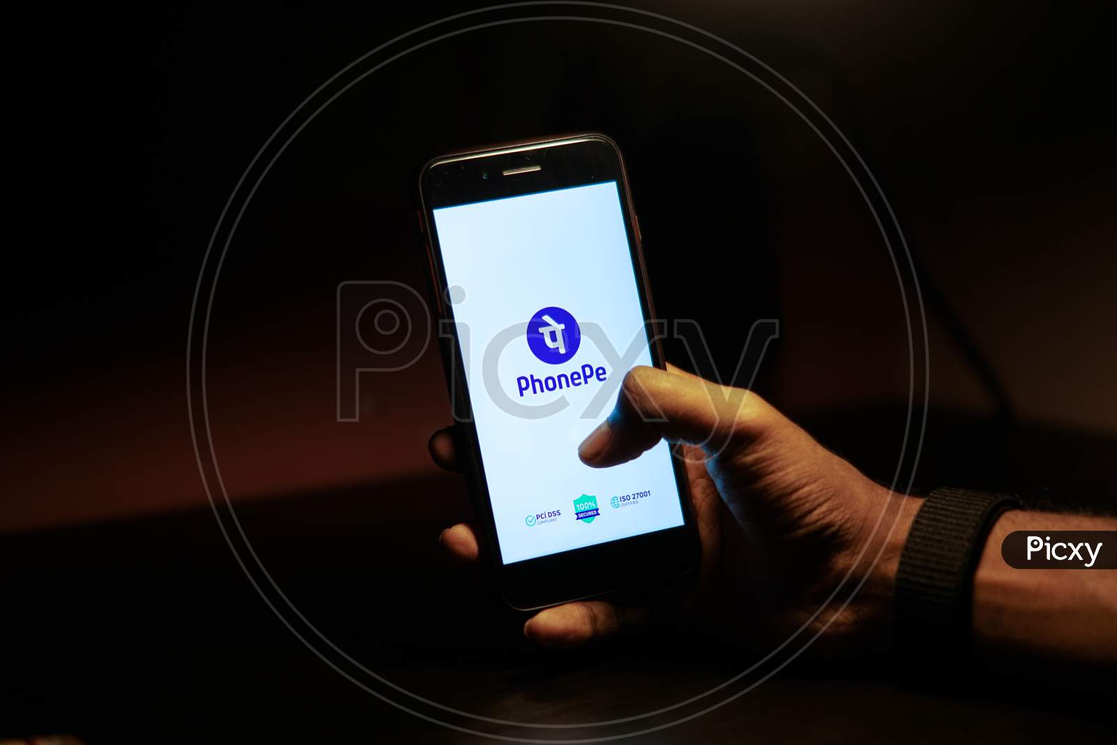PhonePe Mobile App Icon Opening on Smartphone Screen Closeup With Finger