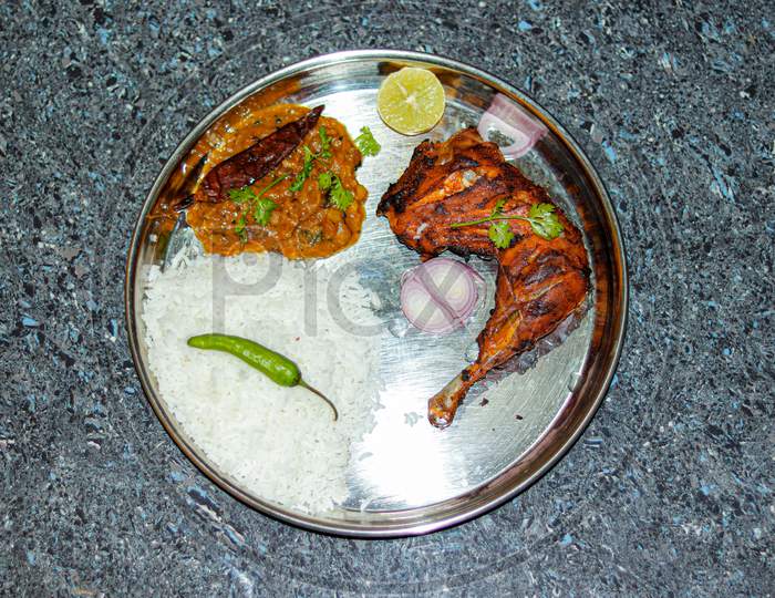 Rice daal fry and chiken tandoori