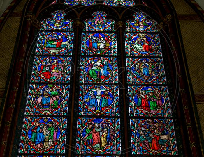 Painted Glass On A Church At Brugge In Bruges, Belgium, Europe