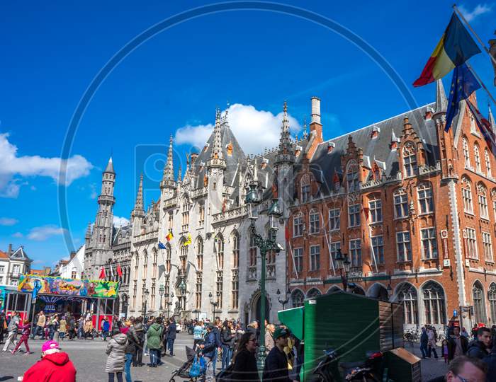 Brugge, Belgium - April 17 :  Toursists Walking At The Gtote Markt Square In Bruges, Belgium, Europe