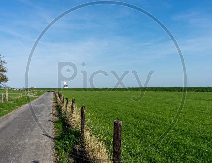 Netherlands,Wetlands,Maarken, A Large Green Field With Trees In The Background