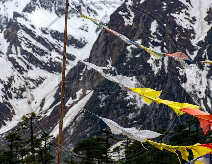 Buddhist prayer flags in Eastern Himalaya North Sikkim India near Yumthang Valley A Beautiful landscape of mountain cover by Snow