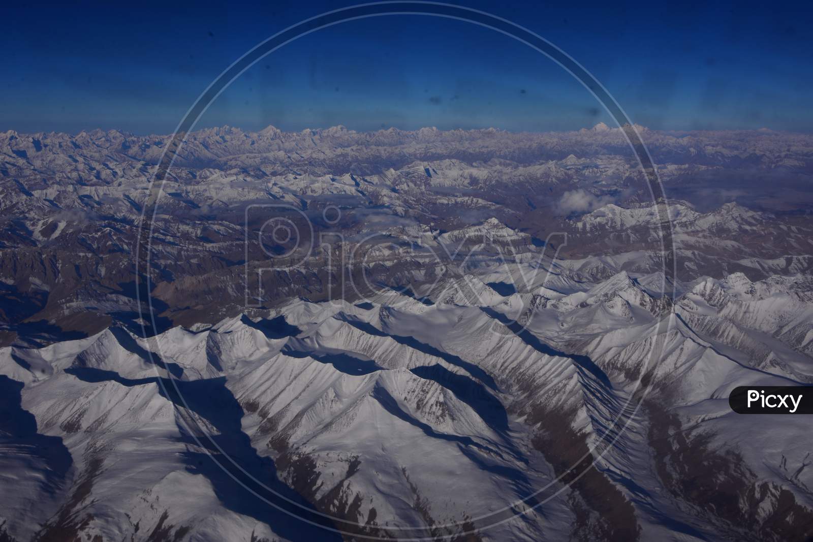 Flight view of snow covered Peak