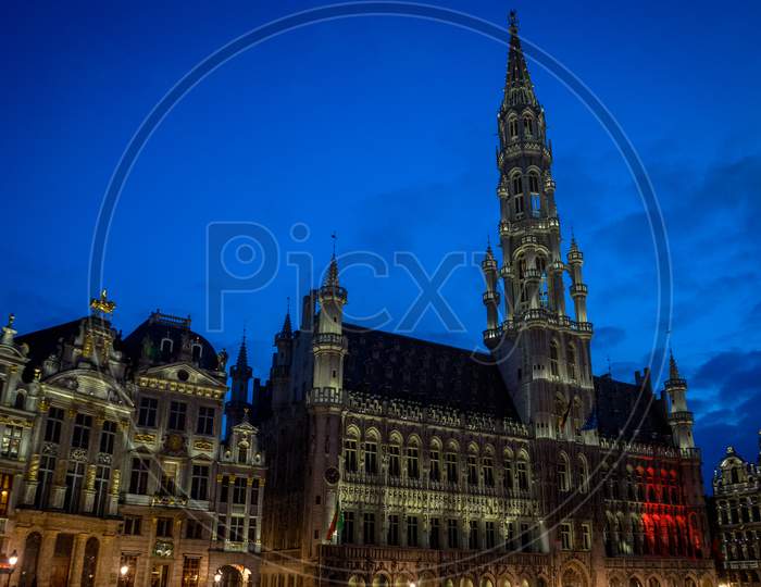 The Palace Of Brussels Illuminated At Night In Market Square At Brussels, Belgium