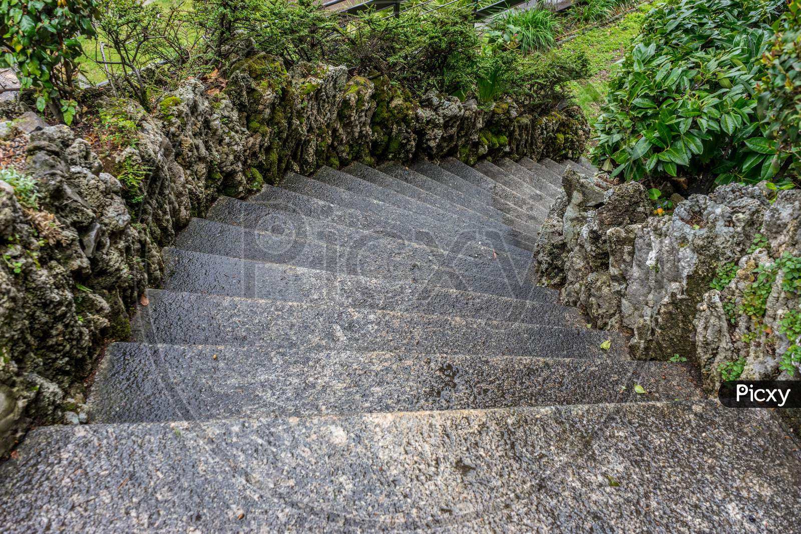 Italy, Varenna, Lake Como, Footpath By Stone Wall In Garden