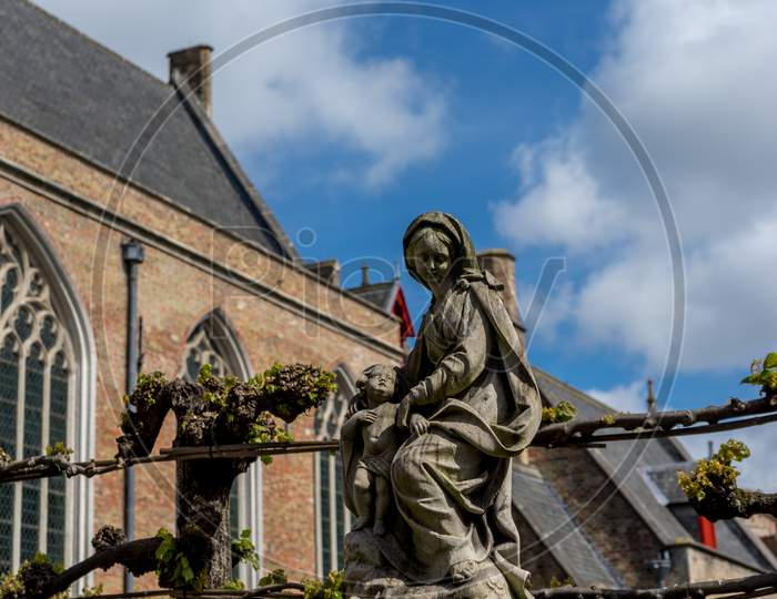 Statue Of The Lady And Baby Jesus Christ At Brugge, Belgium, Europe