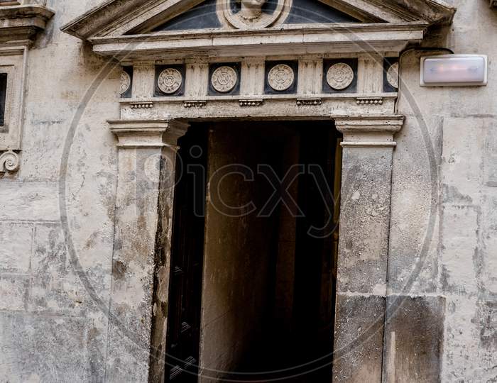 Seville, Spain- June 18, 2017: An Entrance Facade Inside The  Gothic Cathedral In Seville, Spain June 2017