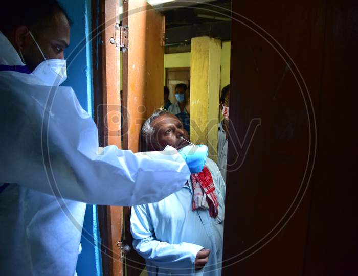 A health worker takes samples for COVID-19 Rapid Antigen Tests, in Nagaon district, in the northeastern state of Assam on Sept 30,2020.