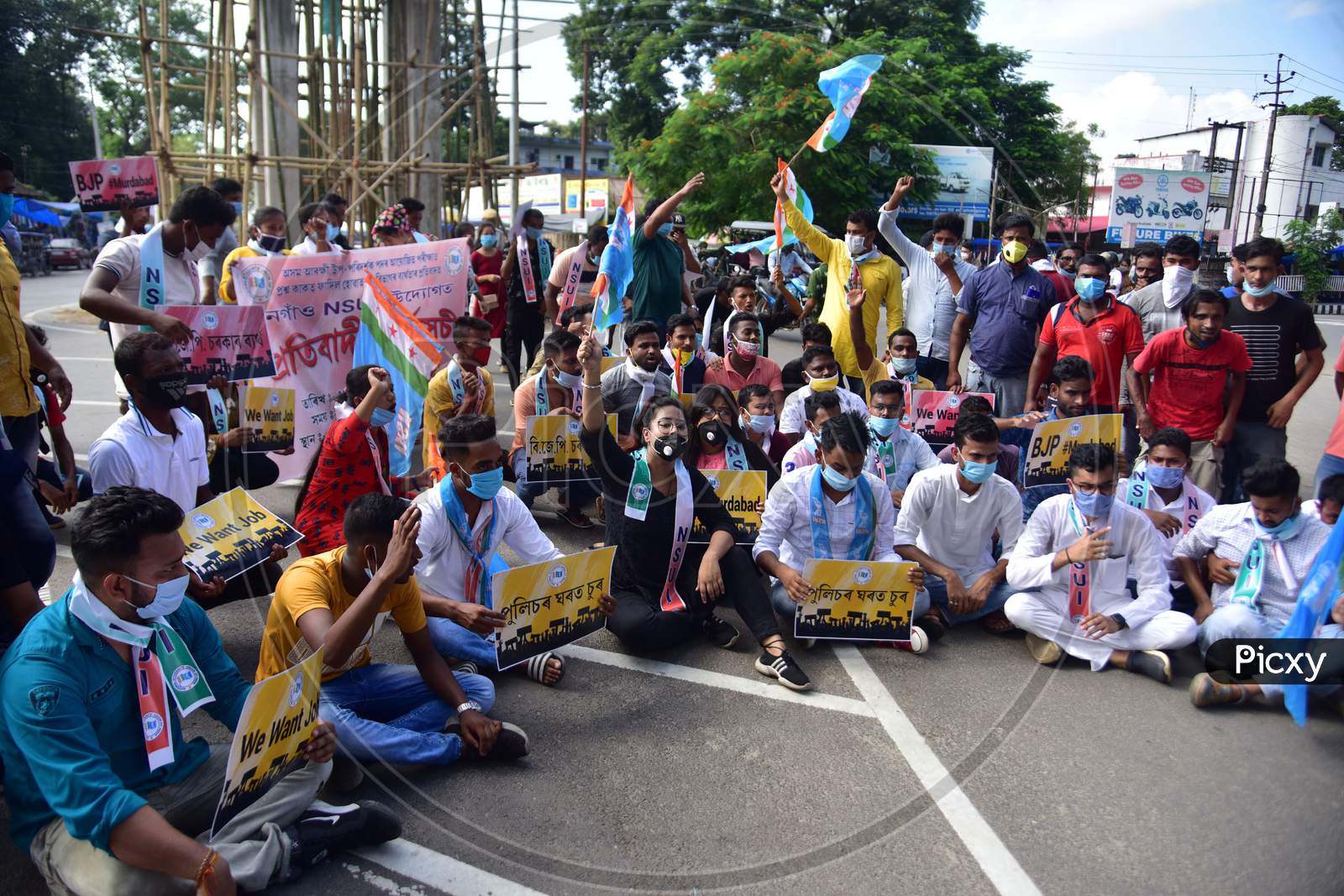 Activists of NSUI block National highway 37 during a protest against the alleged recruitment scam of Assam Police, demanding the arrest of BJP leaders and prime accused Diban Deka in Nagaon District of Assam on Seot 30,2020.