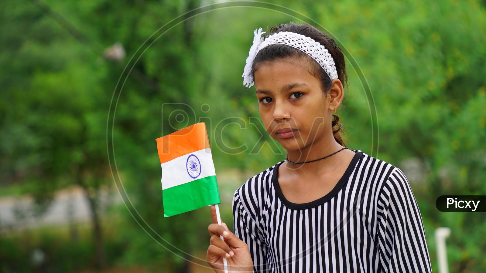 20 September 2020 : Reengus, Jaipur, India / Cute Indian Girl Standing On Roof Holding National Indian Flag.