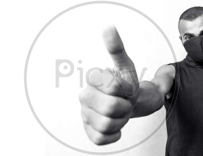 Man With Mask Giving Thumb Up For Appreciation For Precotions Of Corona Virus Panorama In Black And White.