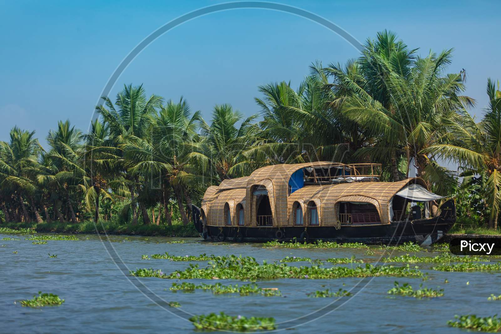Houseboat in the backwaters of Indian state called Kerala.