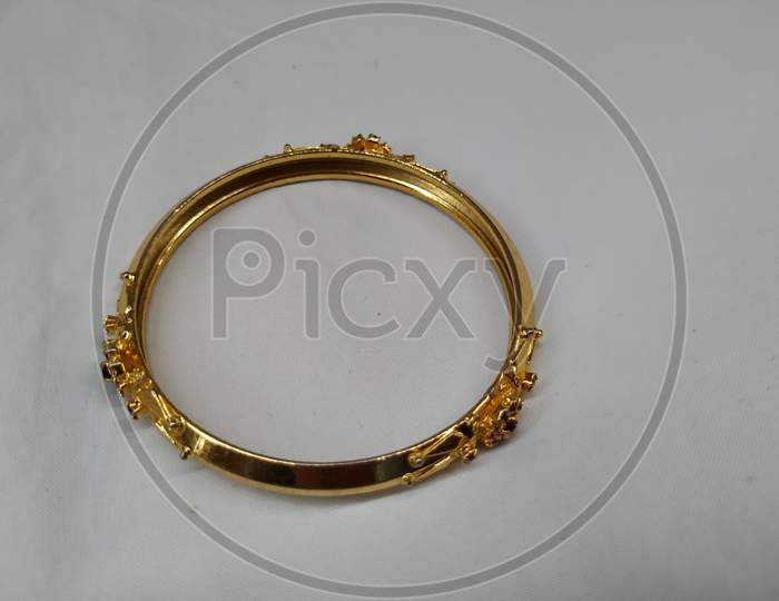 Indian Traditional Women Wear Gold Bangles or Bracelets isolated on white background