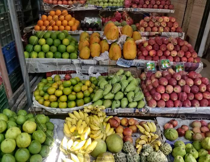 Various healthy and fresh fruits display on market stall for sale