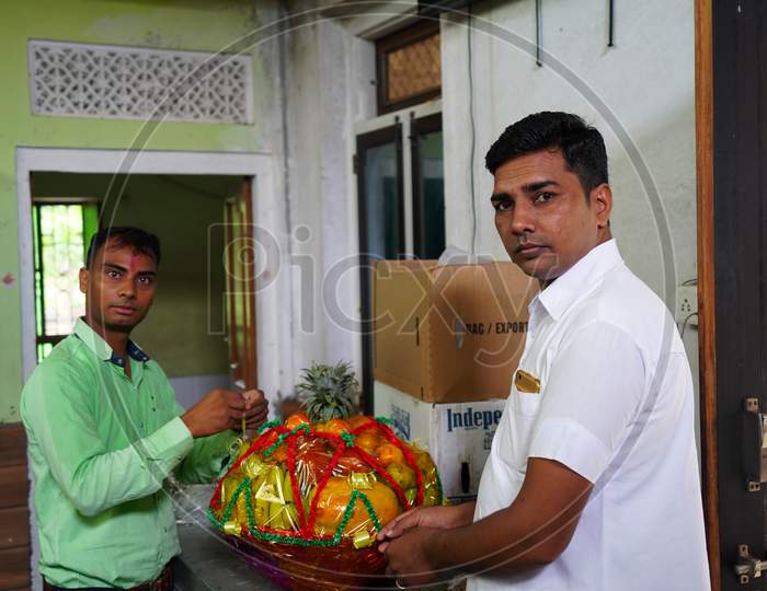 20 September 2020 : Reengus, Jaipur, India / Two Male Movers Wrapping The Home Appliances With Plastic Wrap On Home Background