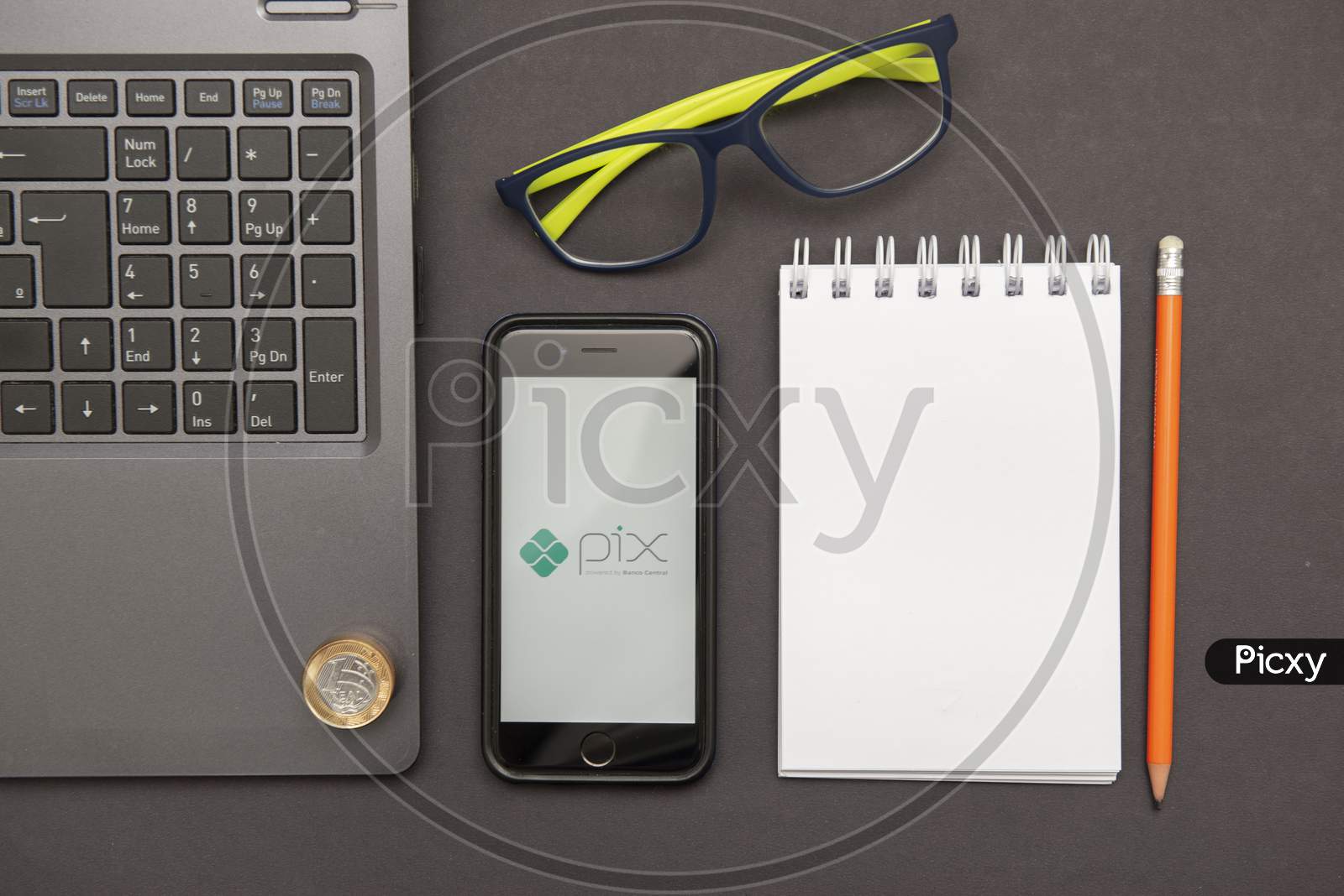 Florianopolis, Brazil. 28/09/2020: Top View Of Pix Logo On Smartphone Screen, Notepad Glasses And Notebook On The Black Table. Pix, New Brazilian Electronic Payment System. Brazilian Central Bank.