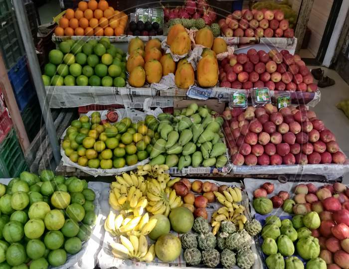 Various healthy and fresh fruits display on market stall for sale