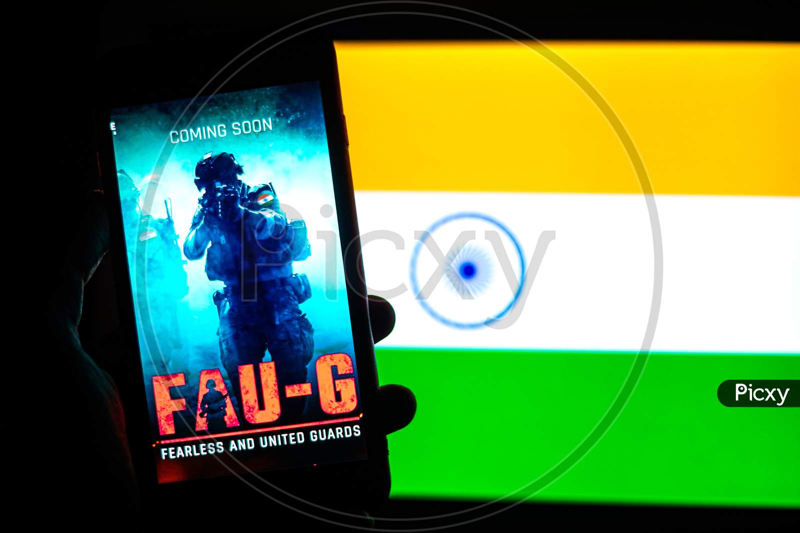 FAUG Game on Mobilephone or Smartphone Screen with Indian Flag in the Background