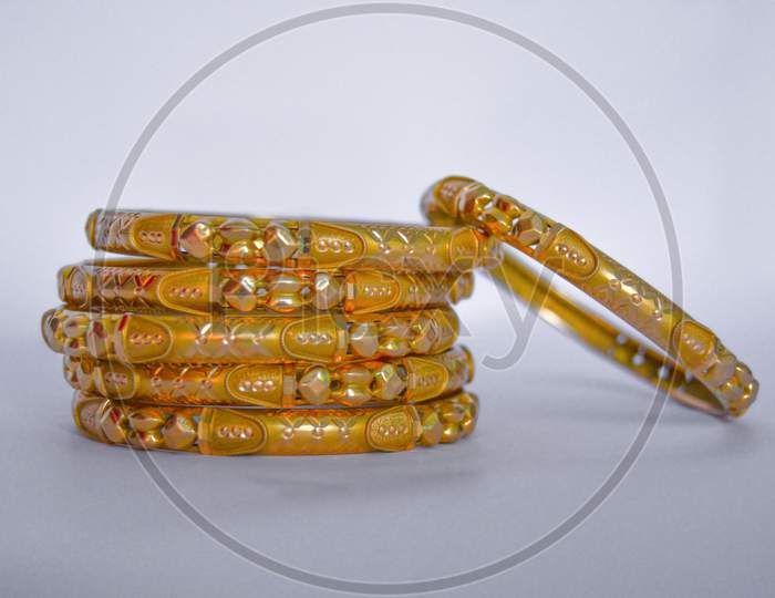 Gold bangles islolated on white background