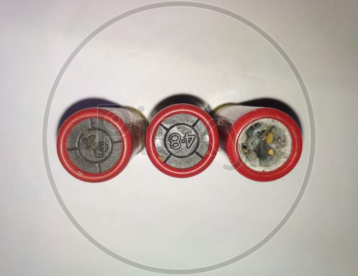 Top view of indian bullets with number on top with white background.