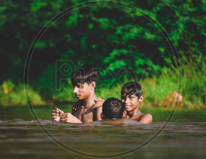 Indian Village kids swimming in a river, Kids swimming