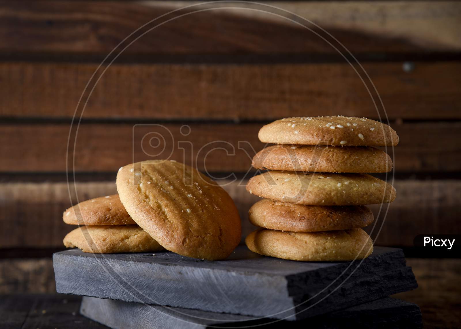 Biscuits Isolated On Dark Background. Atta Biscuit, Cookies, White Flour Biscuit - Indian Cooking