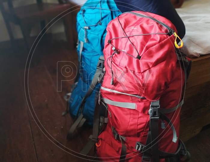 Red and blue rucksack bags