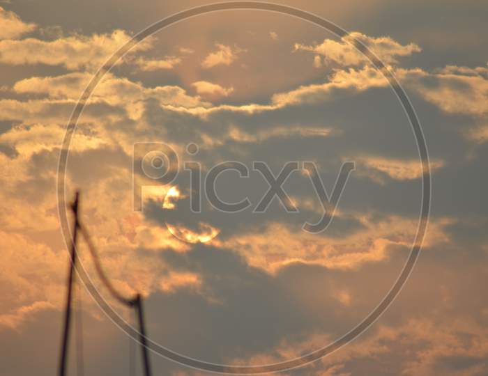 Sun hidden behind the orange clouds, photography