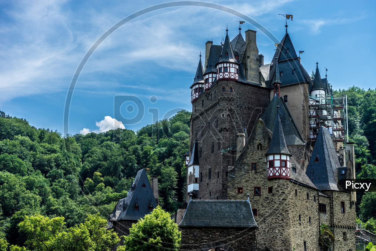 Germany, Burg Eltz Castle, Eltz Castle, A Castle With A Clock At The Top Of Eltz Castle