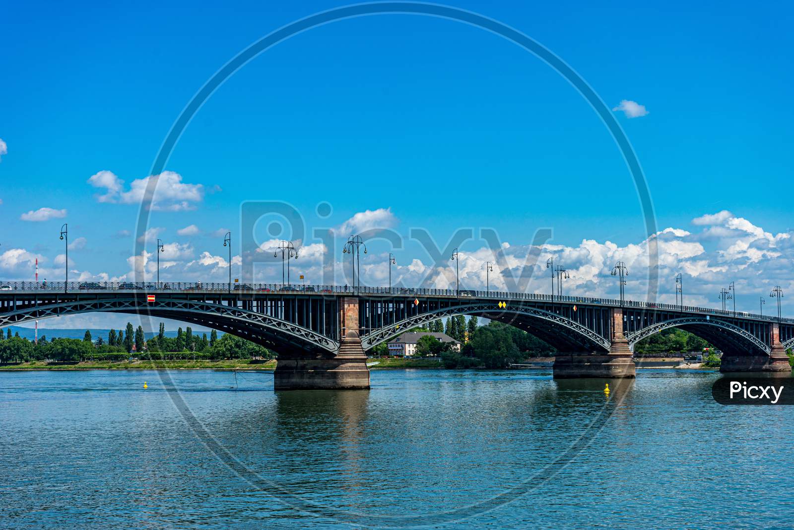 Germany, Heritage Site Mainz, A Train Crossing A Bridge Over Water