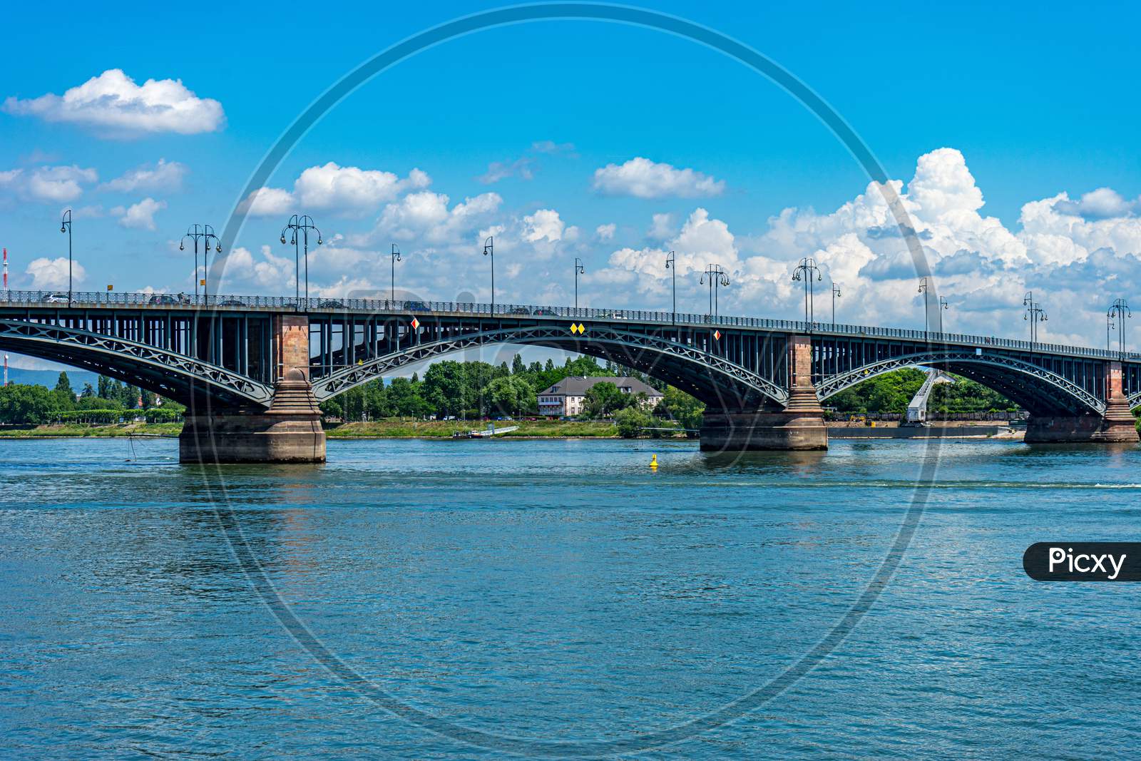 Germany, Heritage Site Mainz, A Train Crossing A Bridge Over A Body Of Water