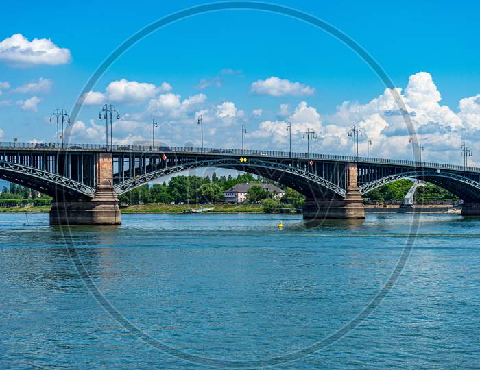Germany, Heritage Site Mainz, A Train Crossing A Bridge Over A Body Of Water