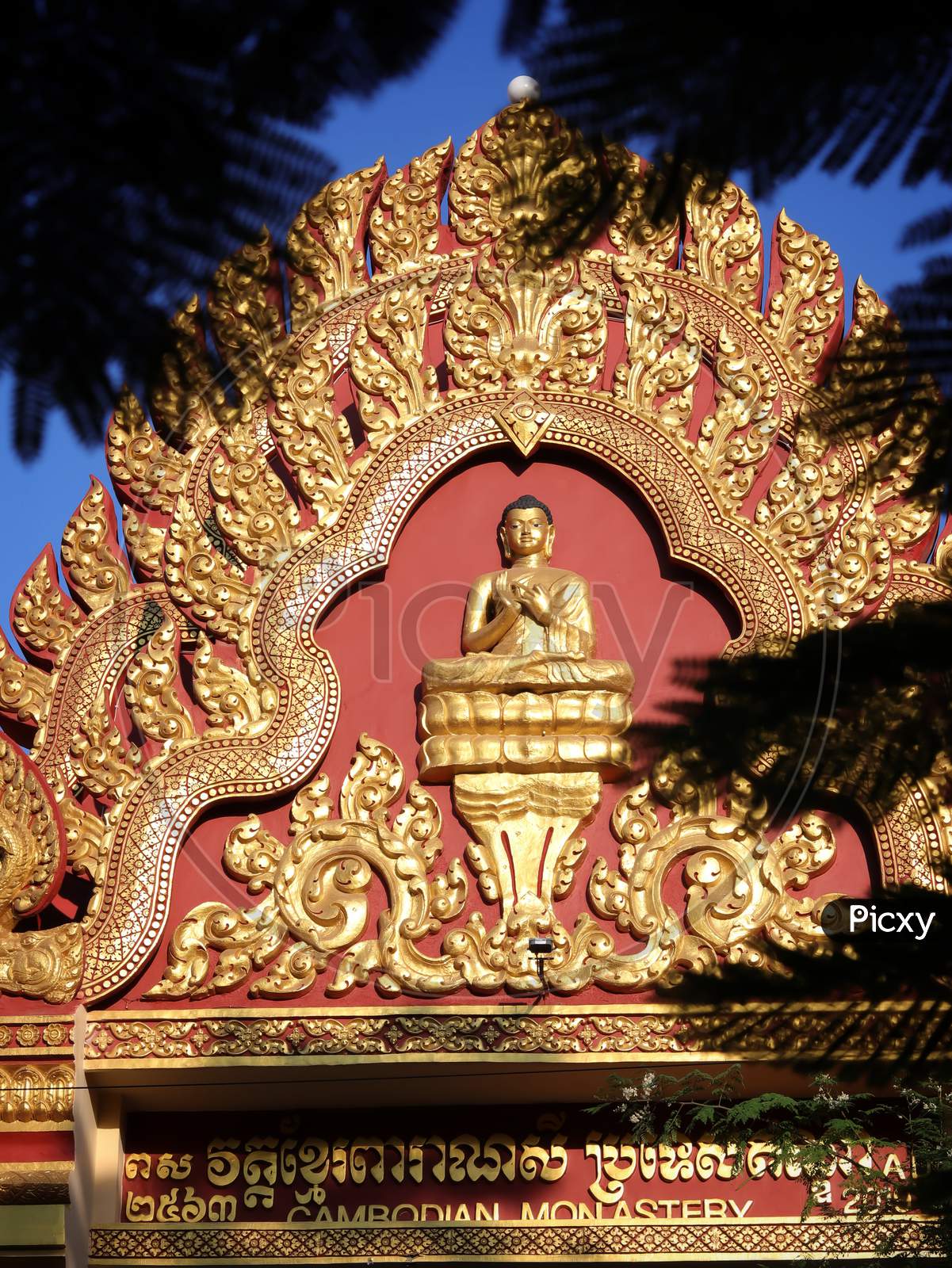 Golden statue of lord Buddha with selective focus.