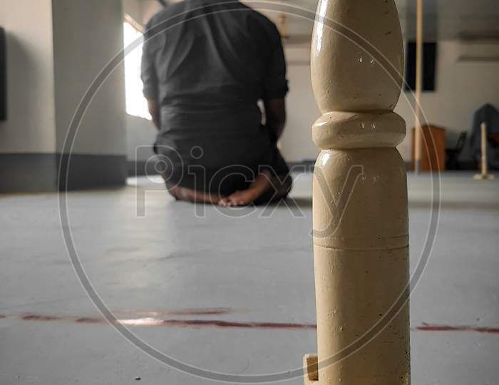 A Muslim pray salat in masjid.