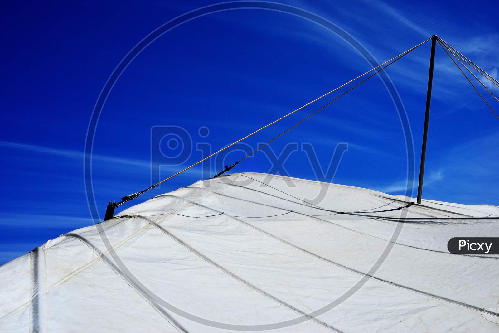 Hang glider wing on a deep blue sky