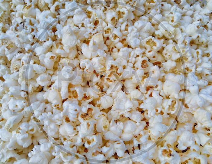 Popcorns close up on full view background.