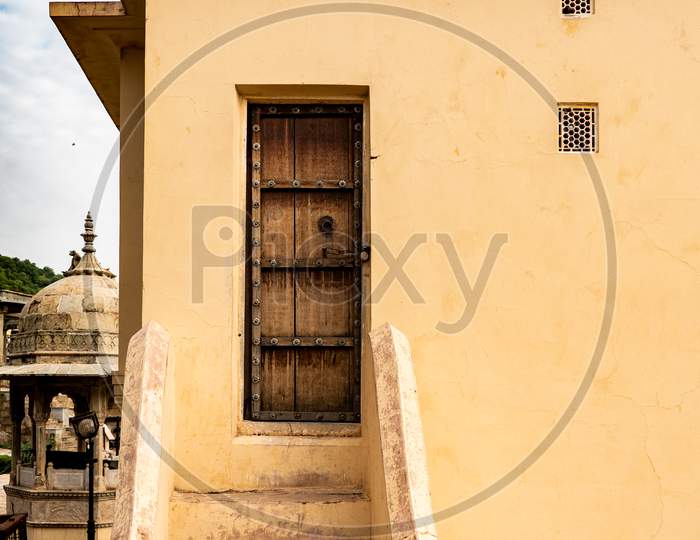 A gate on a old building. Yellow architecture