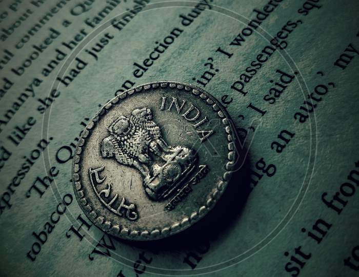 Photography with book and coin