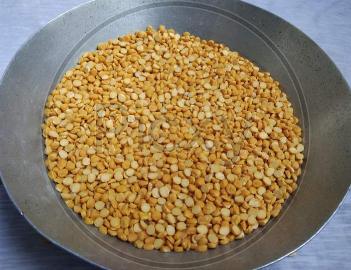 A full bowl of split chickpea. The chickpea or chick pea, Its different types are variously known as gram or Bengal gram, garbanzo or garbanzo bean, Egyptian pea. Chickpea seeds are high in protein