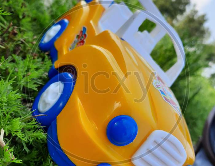 Toy car with green grass